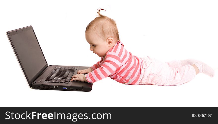 Little baby with laptop on white