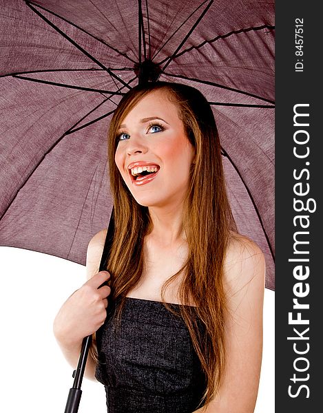 Sidepose of smiling woman holding umbrella with white background