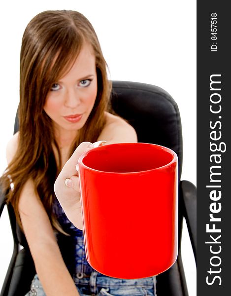 Front view of young woman offering drink on an isolated white background