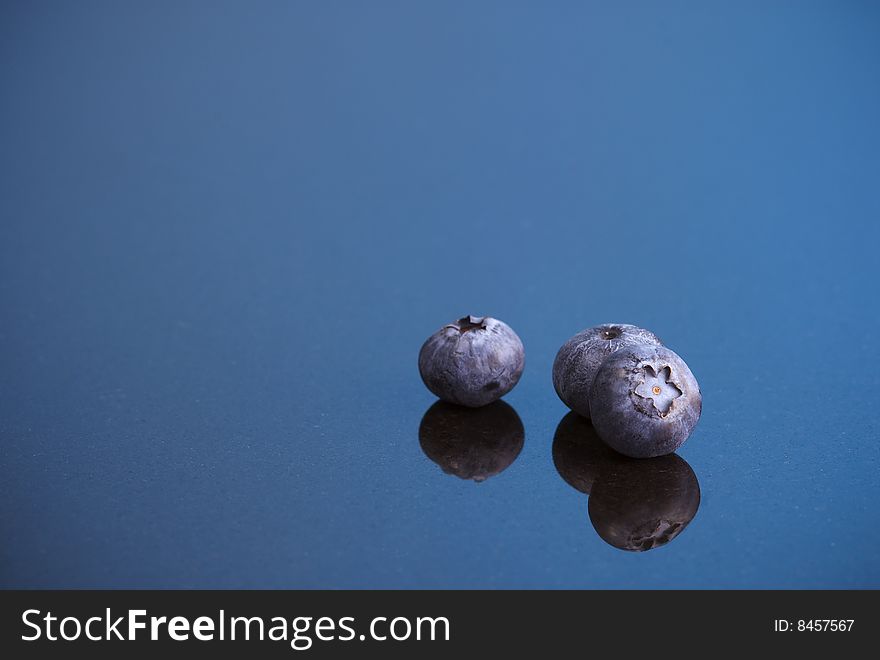Blueberries On Blue Background