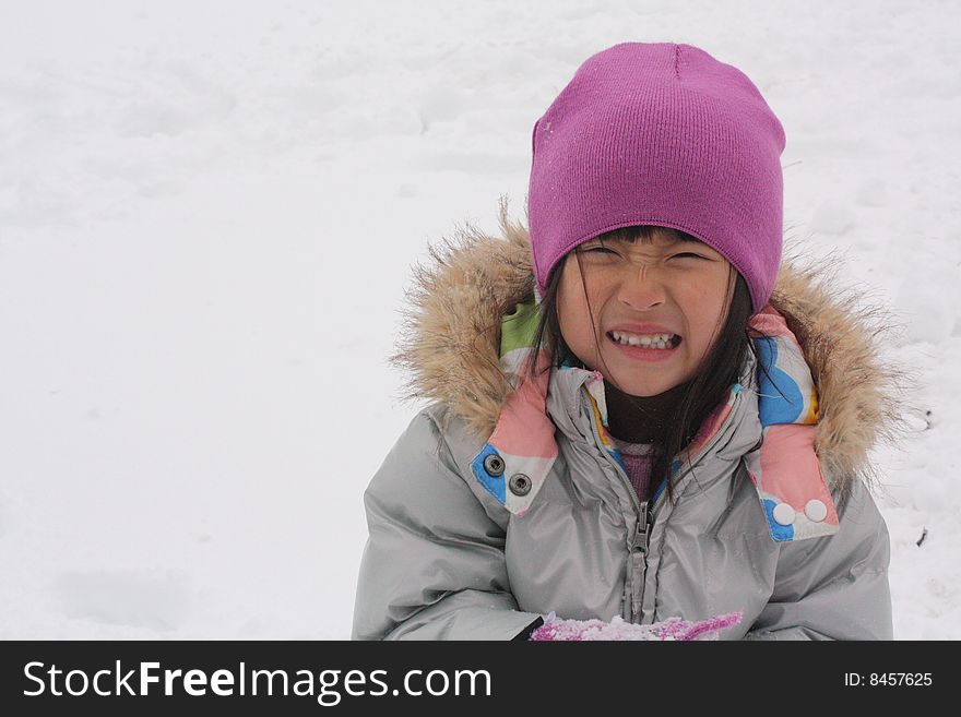 Asian Girl Crying while playing in the snow