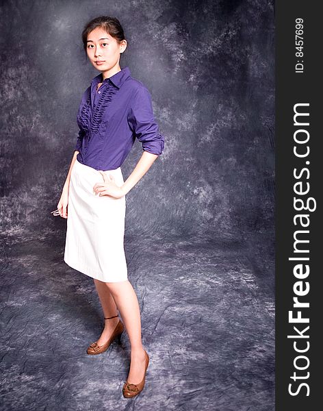 Chinese office lady in purple shirt and white skirt