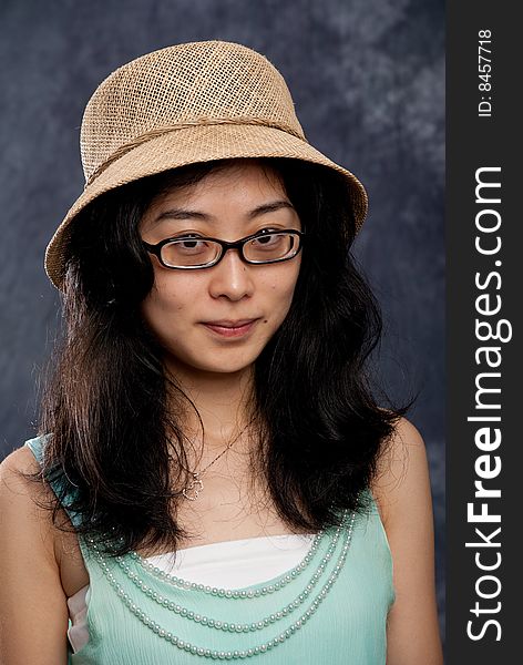 Chinese lady with hat and light green shirt. Chinese lady with hat and light green shirt