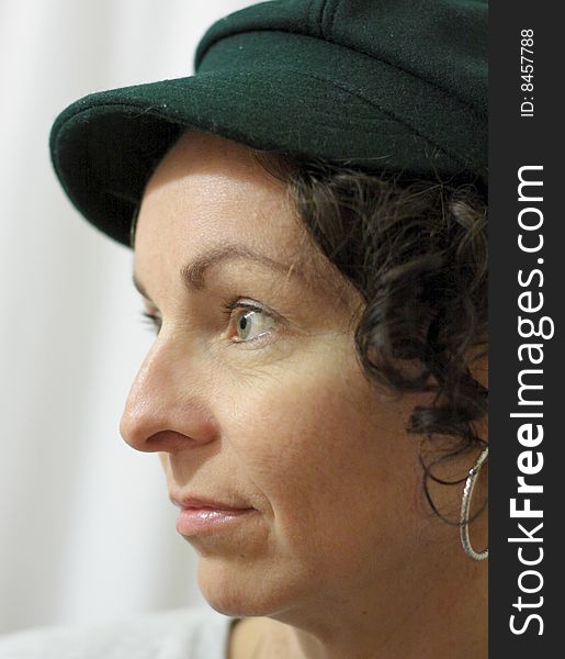 Casual profile portrait of lady in a cap. Casual profile portrait of lady in a cap.