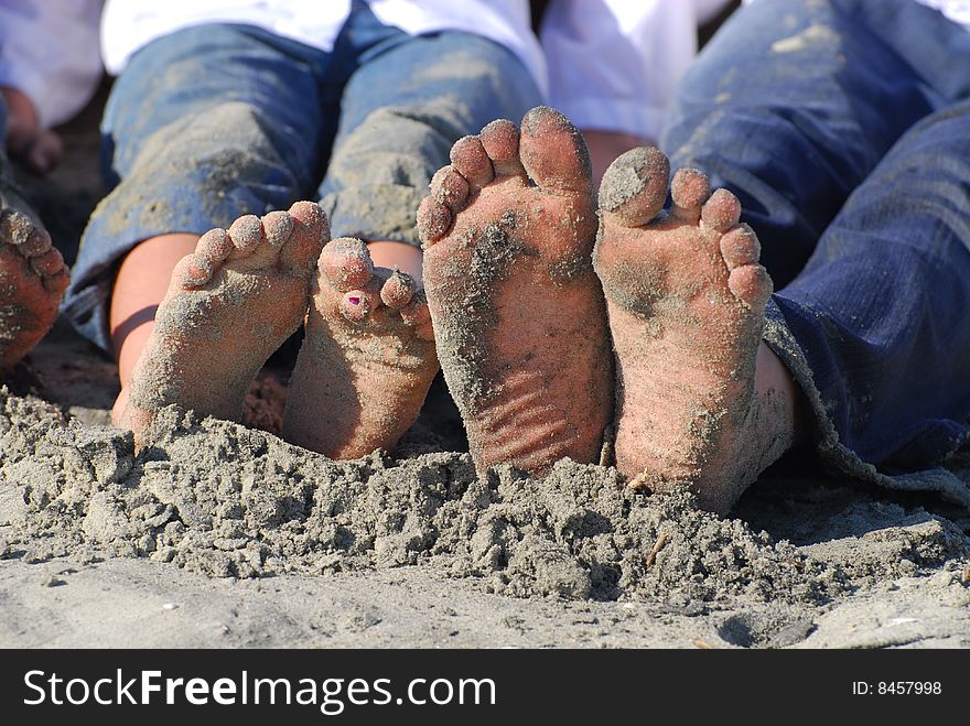 Children's sandy toes while at the beach