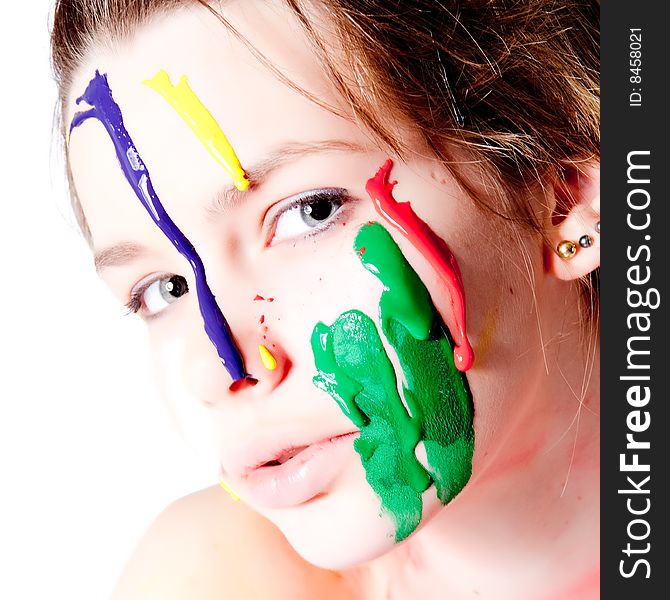 Teenage Girl With Four Colors Of Paint On Her Face