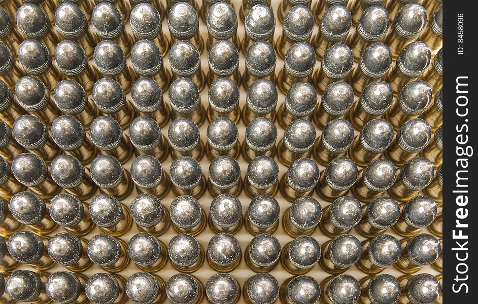 Ammunition is placed in repeating rows. Ammunition is placed in repeating rows