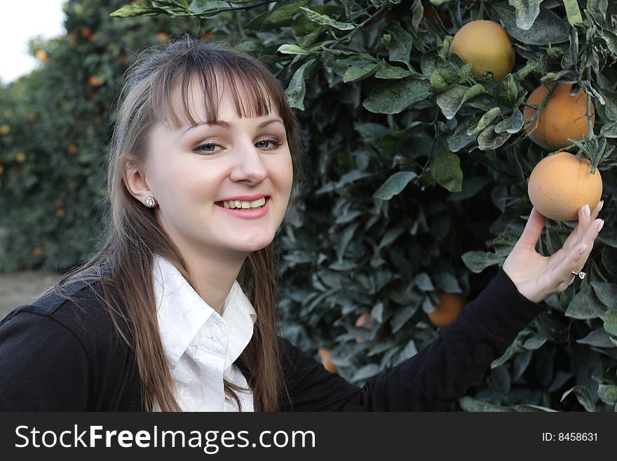 Portrait of smilind girl in a orchard. Portrait of smilind girl in a orchard