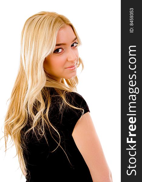 Back pose of smiling female looking at camera on an isolated white background