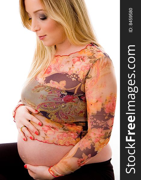 Side view of sitting pregnant female on an isolated background