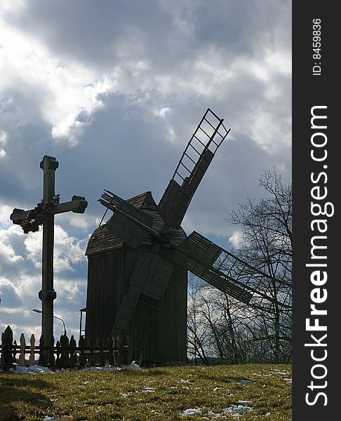 Ancient wooden windmill on the field. Ancient wooden windmill on the field