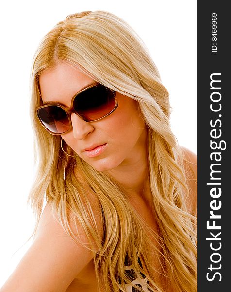 Portrait of sensuous woman wearing sunglasses on an isolated background