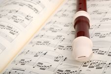 Flute On Musical Sheet Royalty Free Stock Photos