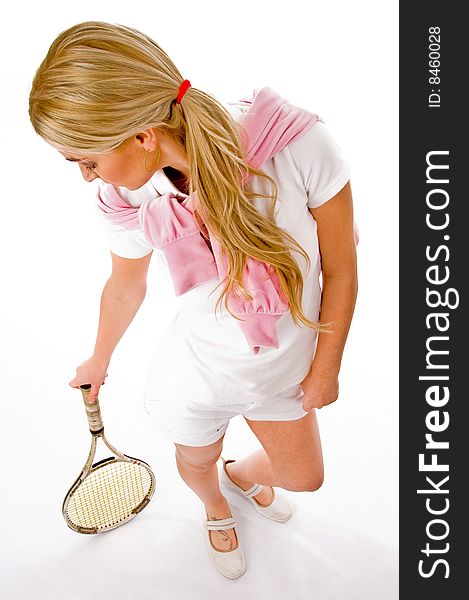 Top view of young woman standing with tennis racket on an isolated background