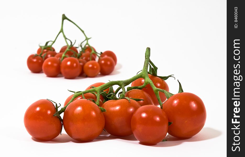 Groups of red tomatoes on white background. Groups of red tomatoes on white background