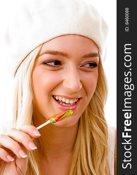 Portrait of smiling woman going to eat candy on an isolated background