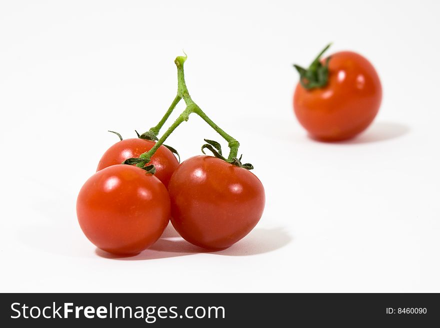 Groups of red tomatoes on white background. Groups of red tomatoes on white background