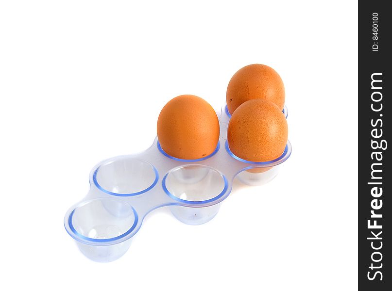 Egg in the eggbox isolated over white