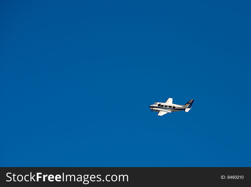 Two engines aircraft flying on blue sky