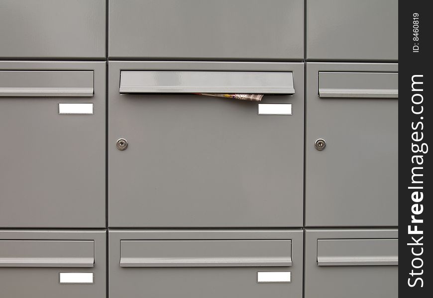 Metallic mailboxes background. (post, postbox, address)