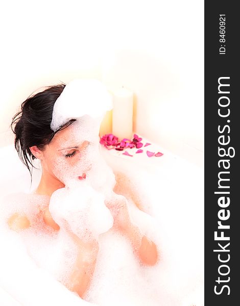 Woman relaxing in bathroam with foam and closed eyes. Woman relaxing in bathroam with foam and closed eyes