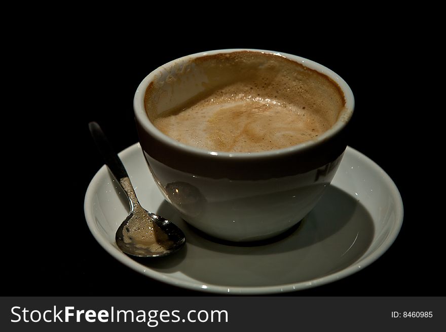 Coffee cup with coffee with a black background. Coffee cup with coffee with a black background