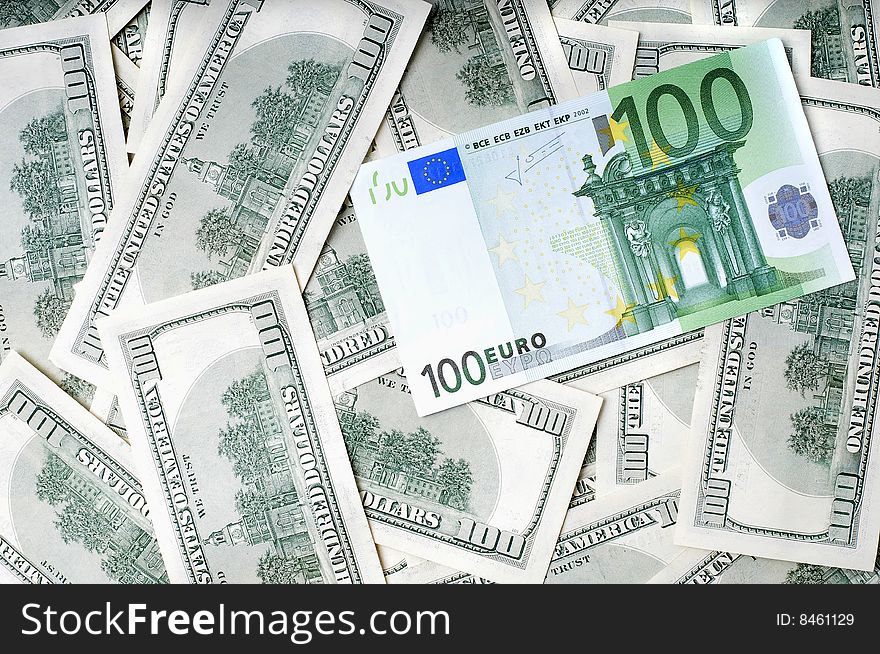 Closeup image of money , lots of 100 US dollar bills and 100 euro