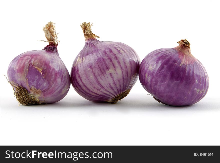Group of red and onions on white