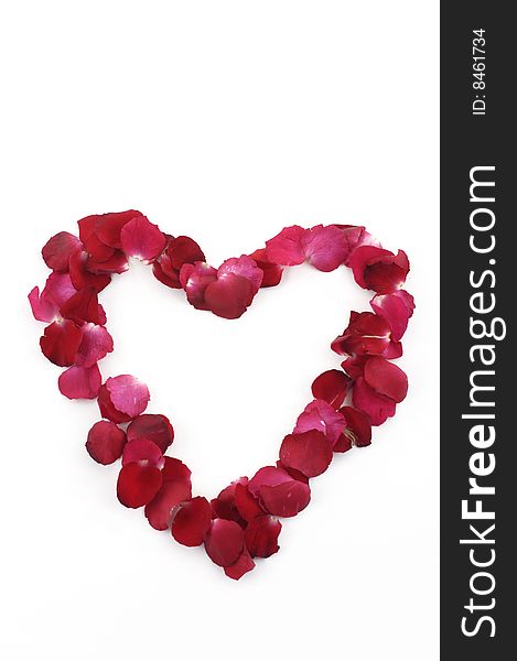 Valentine heart made with red rose petals