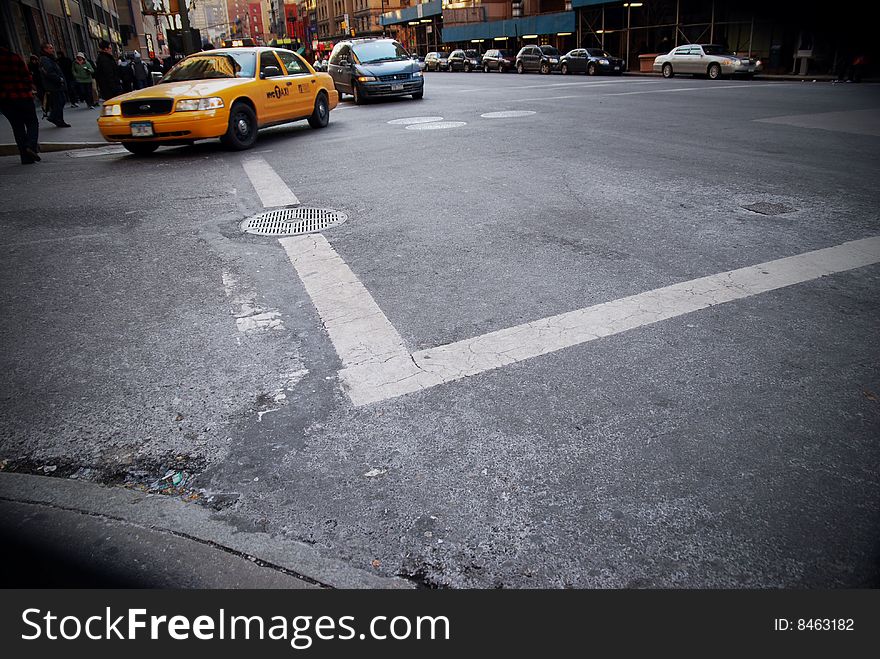 A taxi on a street in New York. A taxi on a street in New York.