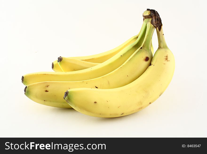 A bunch of bananas displayed on a white background