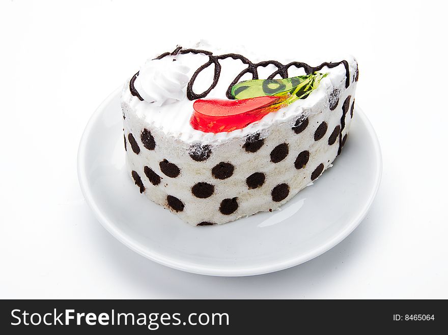 Cake with color jelly on white plate. Cake with color jelly on white plate