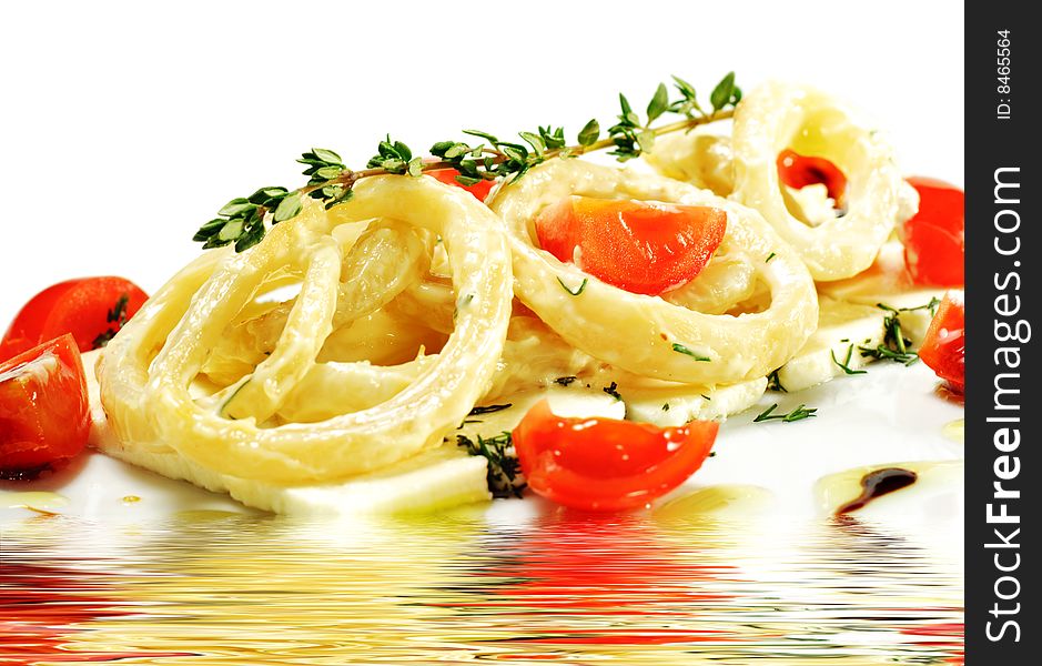 Salad with Calamari Rings, Sheep Cheese and Tomato. Isolated on White Background. Salad with Calamari Rings, Sheep Cheese and Tomato. Isolated on White Background