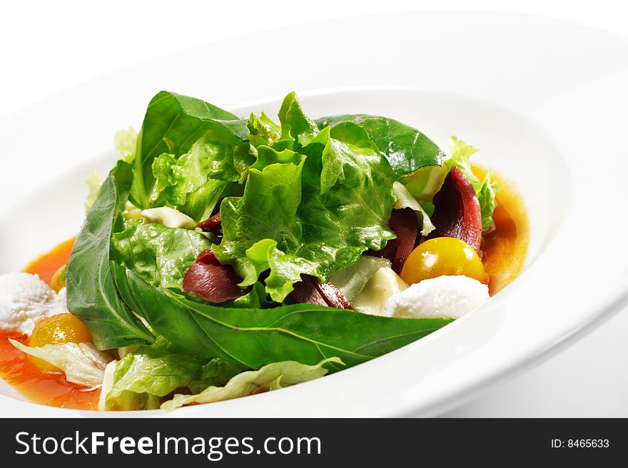 Salad - Smoked Magret (Duck Breast) with Red Chaud-Froid Sauce. Comprises Tomato and Vegetable Leaf. Isolated on White Background. Salad - Smoked Magret (Duck Breast) with Red Chaud-Froid Sauce. Comprises Tomato and Vegetable Leaf. Isolated on White Background