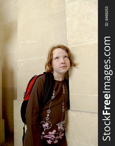 Girl Leans On Wall