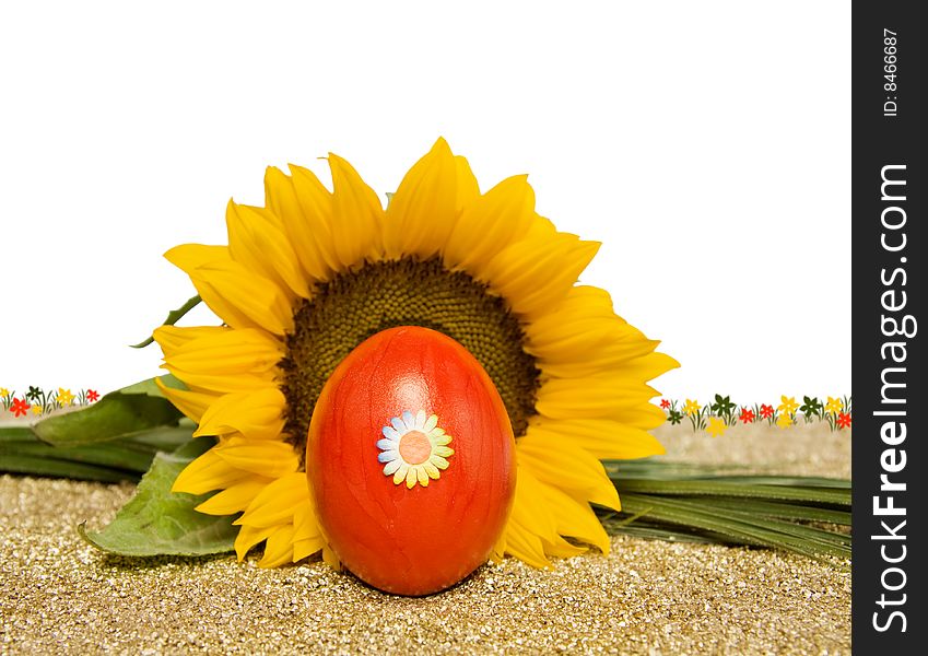 Celebrating Easter spring with red egg and sunflower. Isolated over white with room for your design. Celebrating Easter spring with red egg and sunflower. Isolated over white with room for your design.