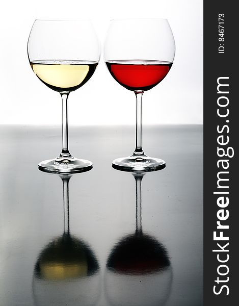 Two Glasses Of Red And White Wine