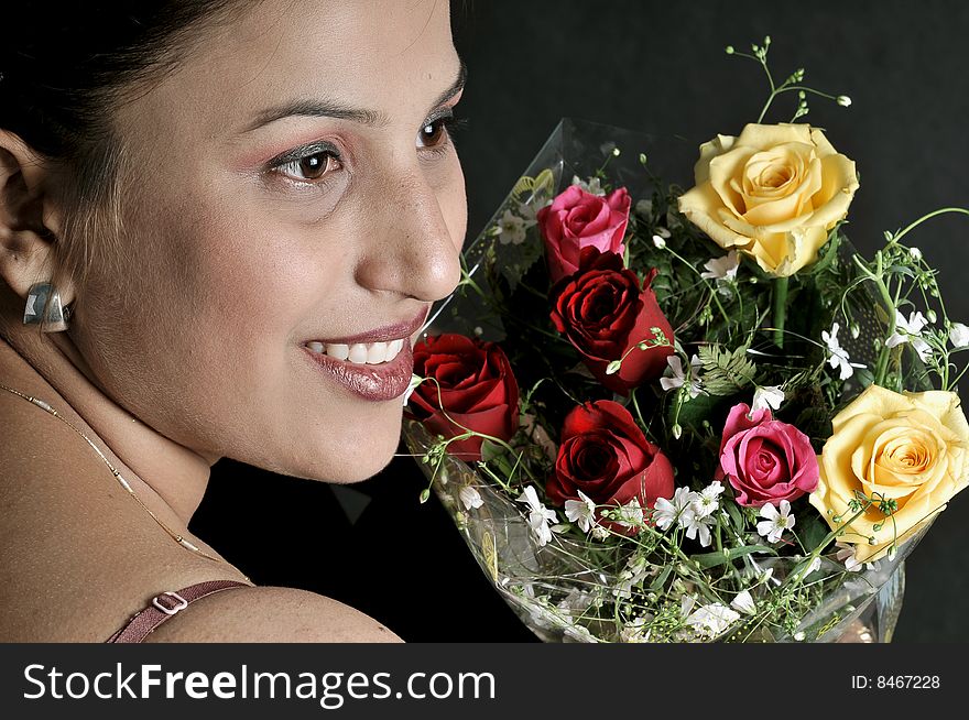 Indian girl model holding a bunch of flowers. Indian girl model holding a bunch of flowers.