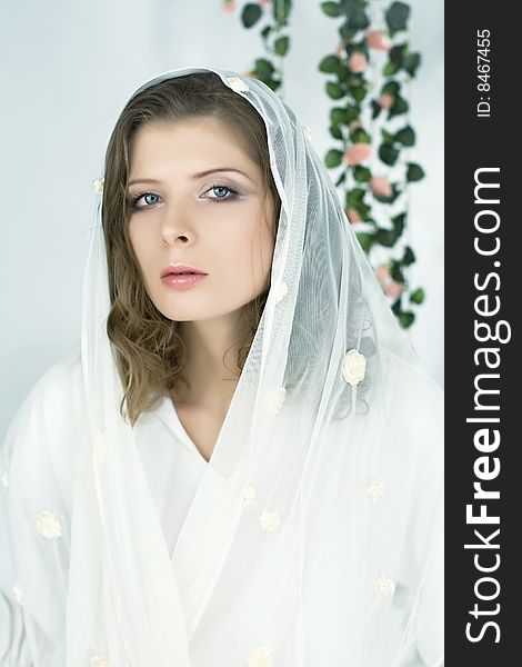 Portrait of the most beautiful romantic woman in the white shawl. Portrait of the most beautiful romantic woman in the white shawl.