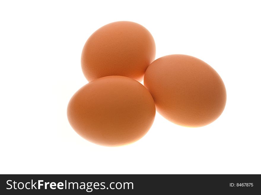 Group of 3 hen's eggs on white shot on light table. Group of 3 hen's eggs on white shot on light table.