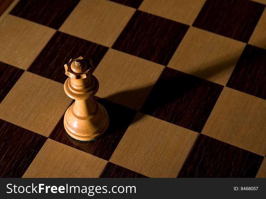 Queen Dramatically Isolated On Chess Board