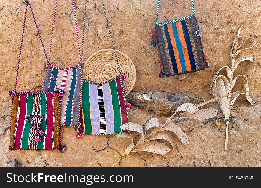 Ornamental striped bags on the wall. Ornamental striped bags on the wall