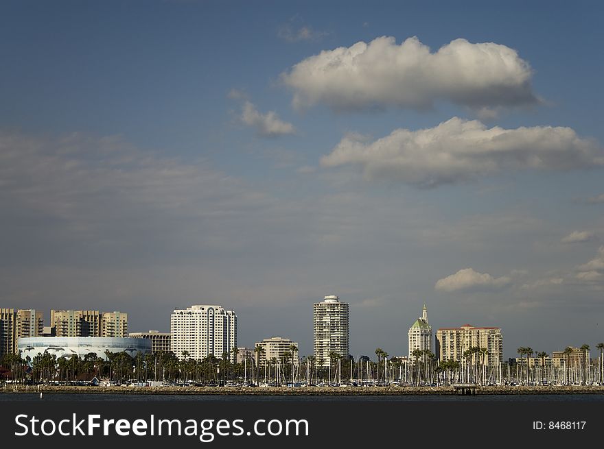 Cumulus clouds float over the condos, office buildings and Convention Center in the city of Long Beach, California. Cumulus clouds float over the condos, office buildings and Convention Center in the city of Long Beach, California.