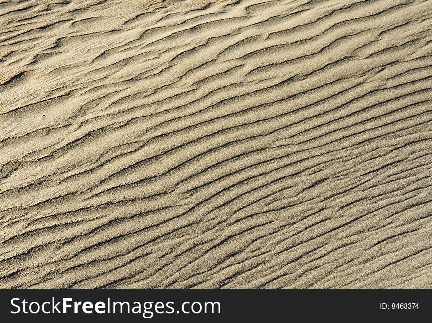 A wavy sand-dune background somewhere in the desert