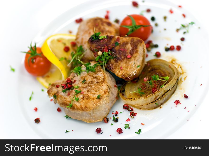 Pork fillet-tenderloin,with baked onion,tomato