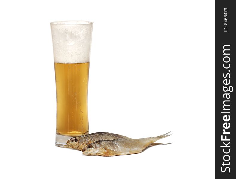 Glass of beer and dried fish on white blackground