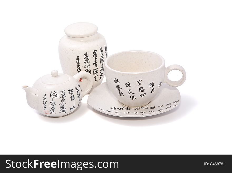 Tea-things in asian style with hieroglyphics. Isolated on white. Path included