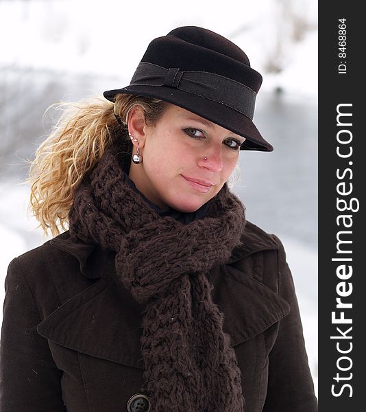 Curly girl with brown hat