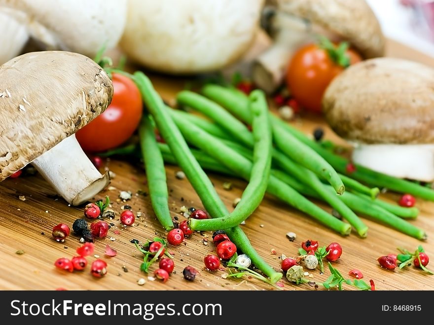 White and brown mushrooms,green beans - raw. White and brown mushrooms,green beans - raw.