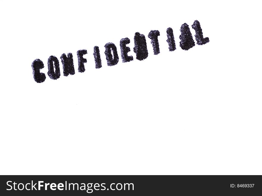 Top view of a rubber stamp with a giant word CONFIDENTIAL printed, on isolated white background.